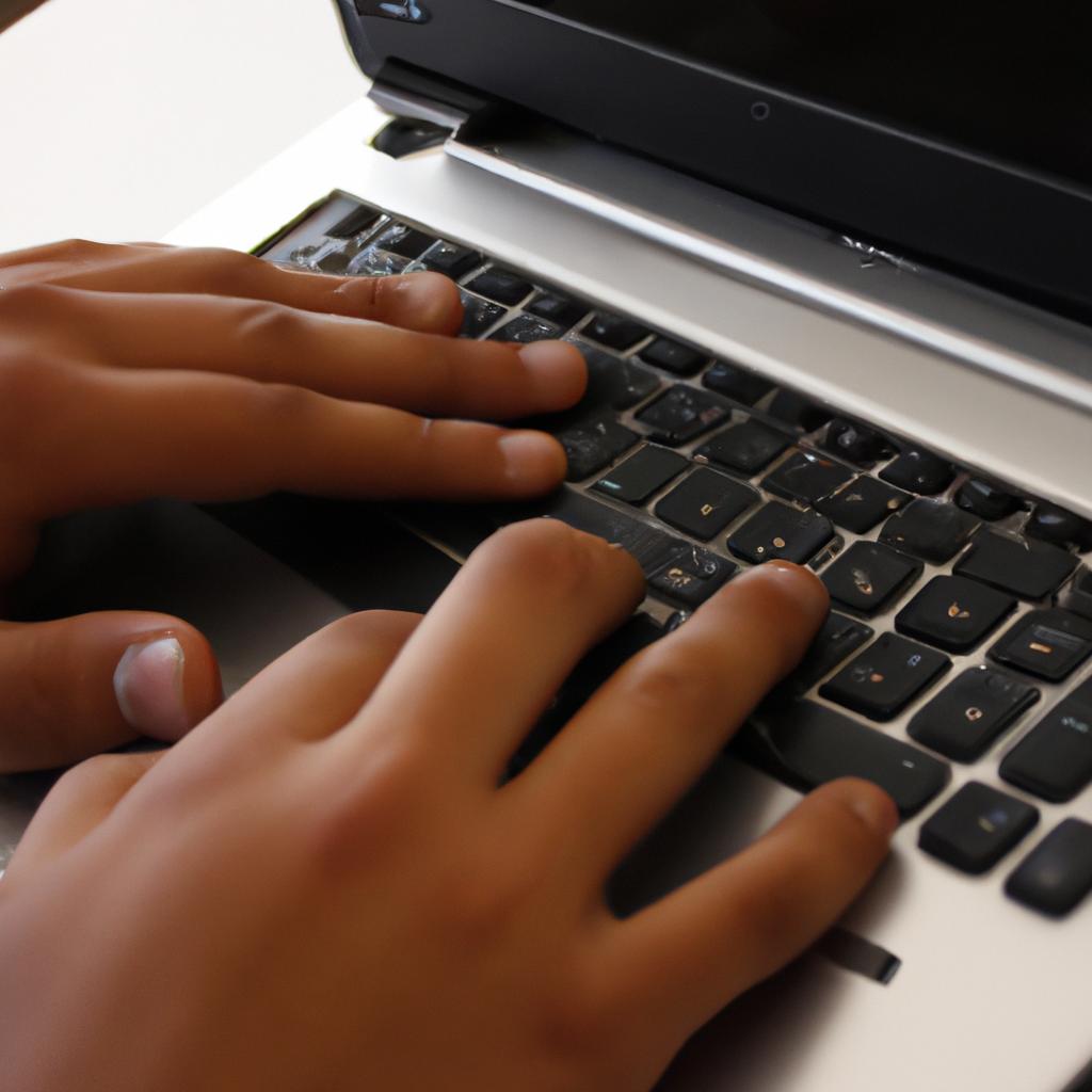 Person typing on a computer